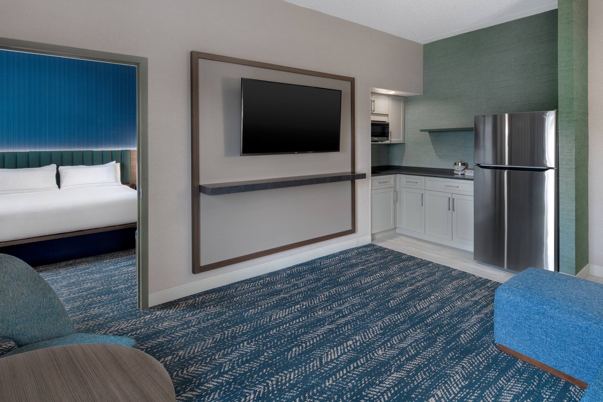 Two-room hotel suite prepared for an overnight stay